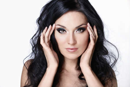 A beautiful young girl with makeup on white backgroundの写真素材