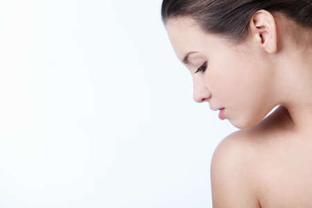 A beautiful young girl on a white backgroundの写真素材