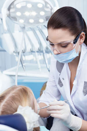 Child treated teeth in the dental clinicの写真素材