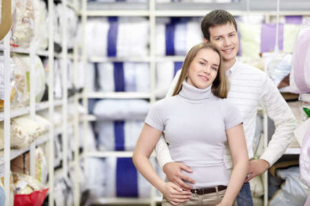 Embracing a married couple in the storeの写真素材