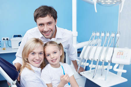 Young family with a child in dentistryの写真素材