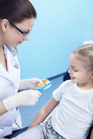 Dentist shows how to properly clean your teethの写真素材
