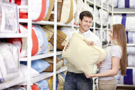 Young married couple shopping in a storeの写真素材