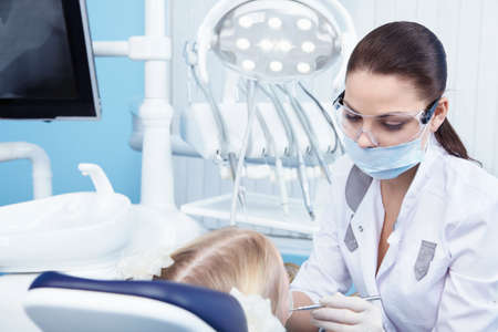 Young dentist at work in the officeの写真素材