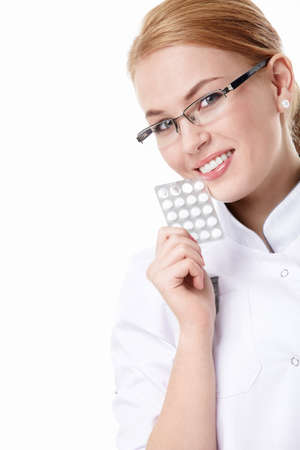 An attractive keeps the doctor pills on white backgroundの写真素材