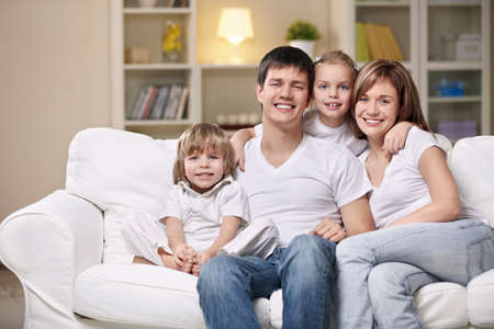 Smiling family home eveningの写真素材