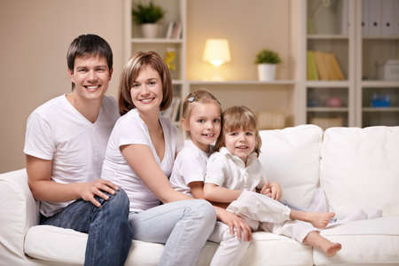 Families with children in the evening at homeの写真素材