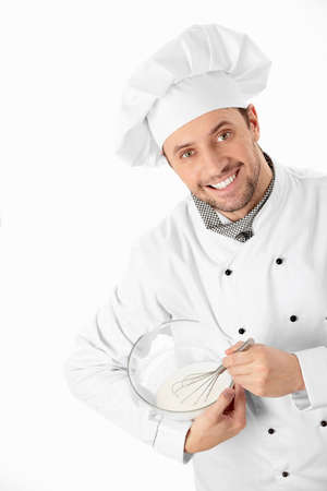 A cook prepares a white backgroundの写真素材