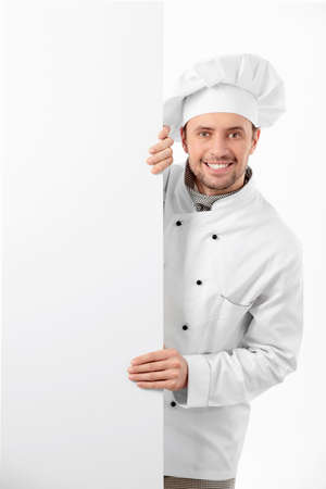 Cook holds a blank bannerの写真素材