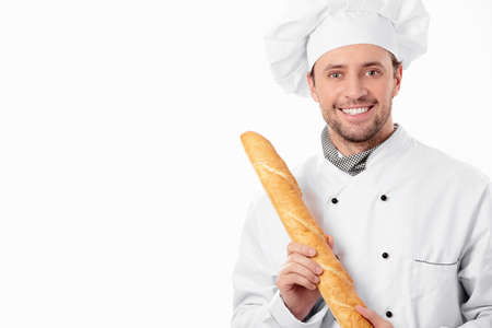 Cook is holding the bread on a white backgroundの写真素材