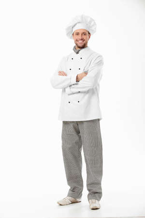 Attractive smiling chef on a white backgroundの写真素材