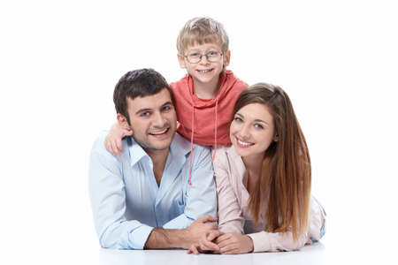 Smiling family with a child on a white backgroundの写真素材