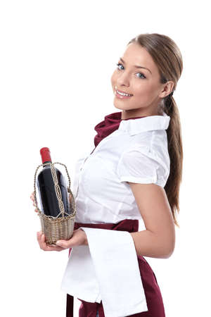Attractive waitress with a bottle of wine on a white backgroundの写真素材