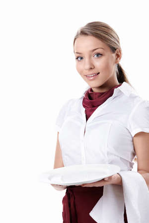 A young waitress with an empty plate on a white backgroundの写真素材