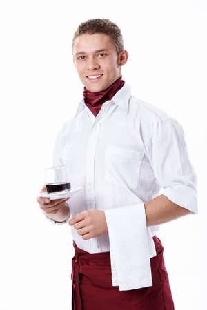 The young waiter with a glass on a white backgroundの写真素材