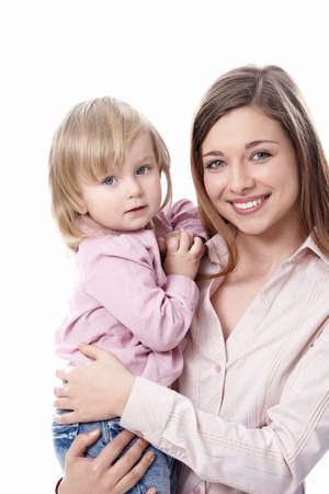 Young mother with her ??daughter in her arms on a white backgroundの写真素材