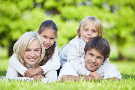 A happy family with children outdoorsの写真素材