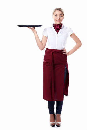 A young attractive waitress with a tray on a white backgroundの写真素材