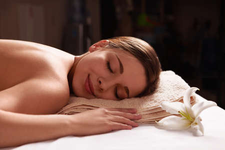 Young girl relaxing in spa salonの写真素材
