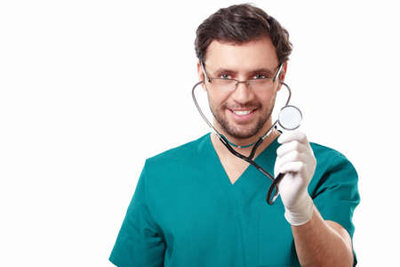 Attractive surgeon with a stethoscope on a white background