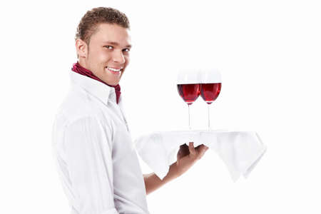 The young waiter with a tray of glasses on a white backgroundの写真素材