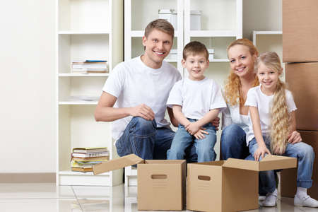 Families with kids and boxes indoorsの写真素材