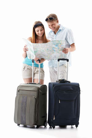 An attractive couple with their suitcases looking card is isolatedの写真素材