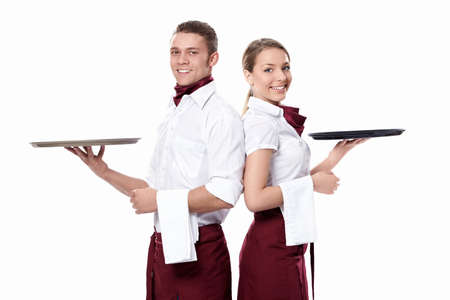 Two attractive waiters on a white backgroundの写真素材