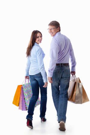 Young couple with a package on a white backgroundの写真素材
