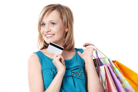 Girl with bags and credit card on a white backgroundの写真素材