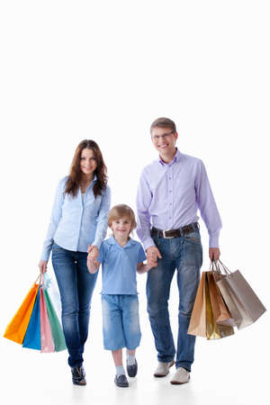 Family with shopping bags on a white backgroundの写真素材