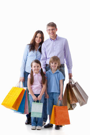 Family with shopping bags on a white backgroundの写真素材