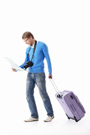 A young man with a suitcase on a white backgroundの写真素材