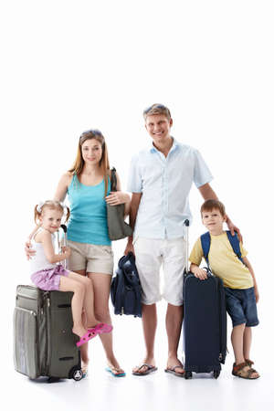Family with luggage on white backgroundの写真素材