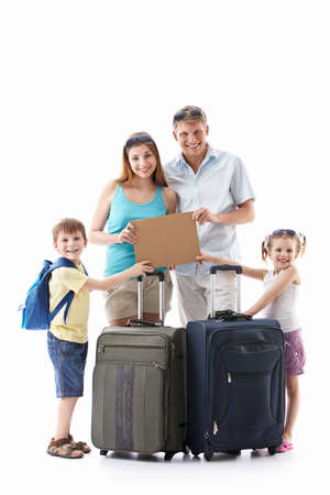 Families with suitcases holding an empty plate on a white backgroundの写真素材