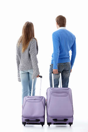 Leaving a couple of suitcases on a white backgroundの写真素材