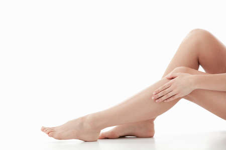 Beautiful legs on a white backgroundの写真素材
