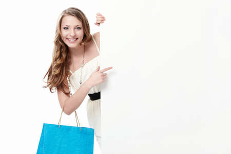 Attractive young girl with a bag, and billboardsの写真素材