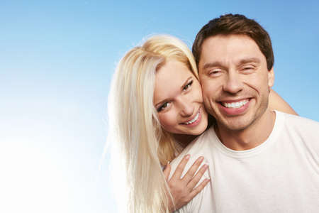 Attractive young couple against the skyの写真素材