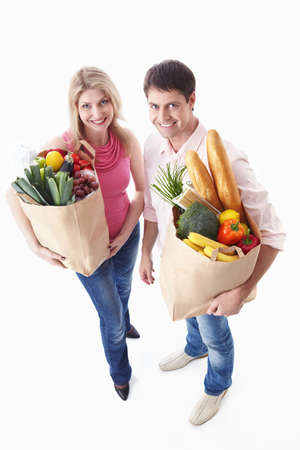 Happy couple with food on a white backgroundの写真素材