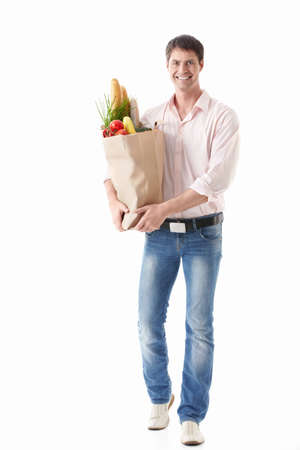 A young man with a package of food on a white backgroundの写真素材