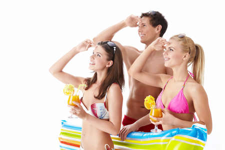 Attractive people in bathing suits looking up isolatedの写真素材