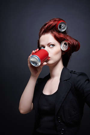 Young girl with a red jar in handの写真素材