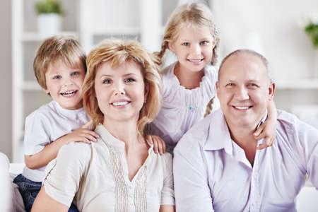 Grandparents with grandchildren at homeの写真素材
