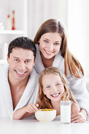 Young family with a child in the kitchenの写真素材