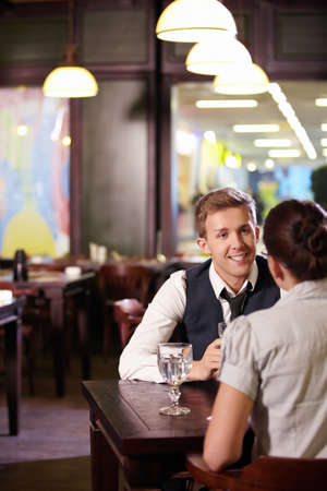 Young couple in restaurantの写真素材