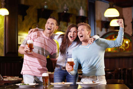 Young people rejoice at the pubの写真素材