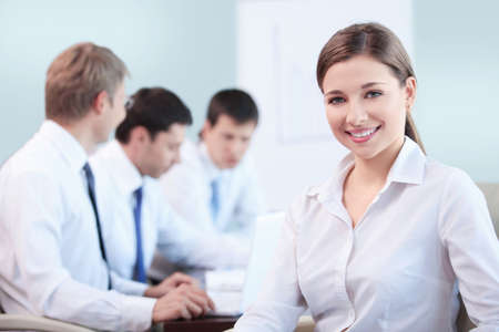 An attractive young girl in the officeの写真素材