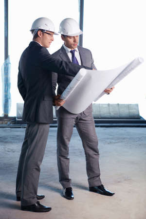 Businessmen held on site planの写真素材
