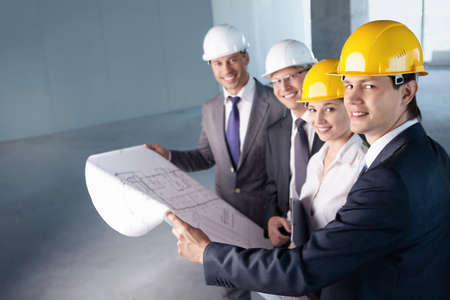 People in helmets on a construction siteの写真素材